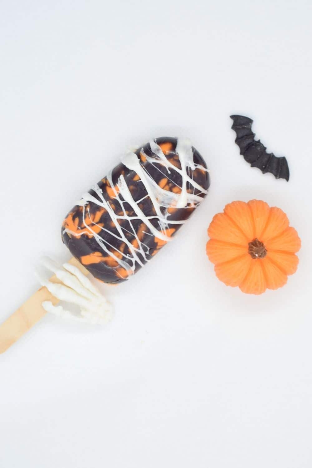 Spiderweb marbled orange cakesicles - marshmallow and orange halloween cake pops