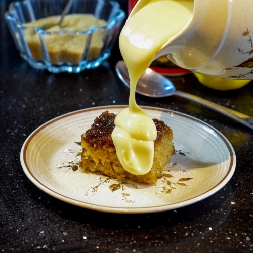 Hot treacle sponge pudding recipe with black treacle and golden syrup. Served with custard