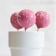 Pink Starbucks copycat vanilla birthday cake pops with white mini pearl sprinkles