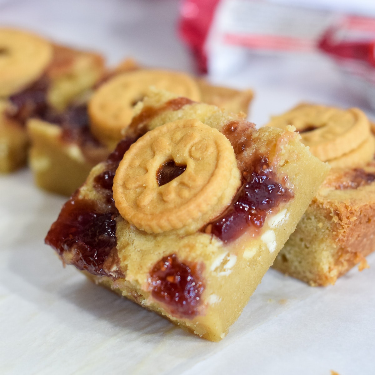 Mini Jammie Dodger blondies recipe with white chocolate chips and a jam swirl