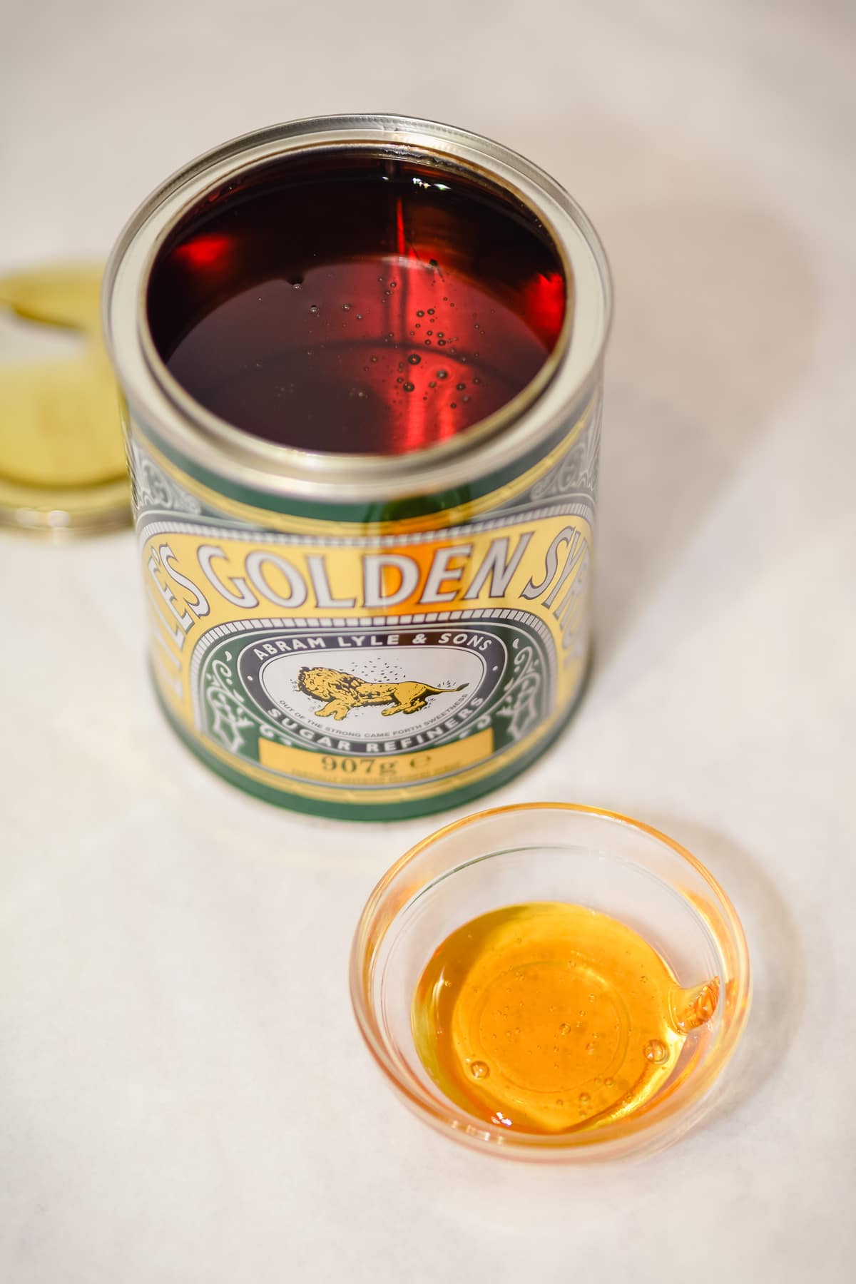 golden syrup in open tin and bowl