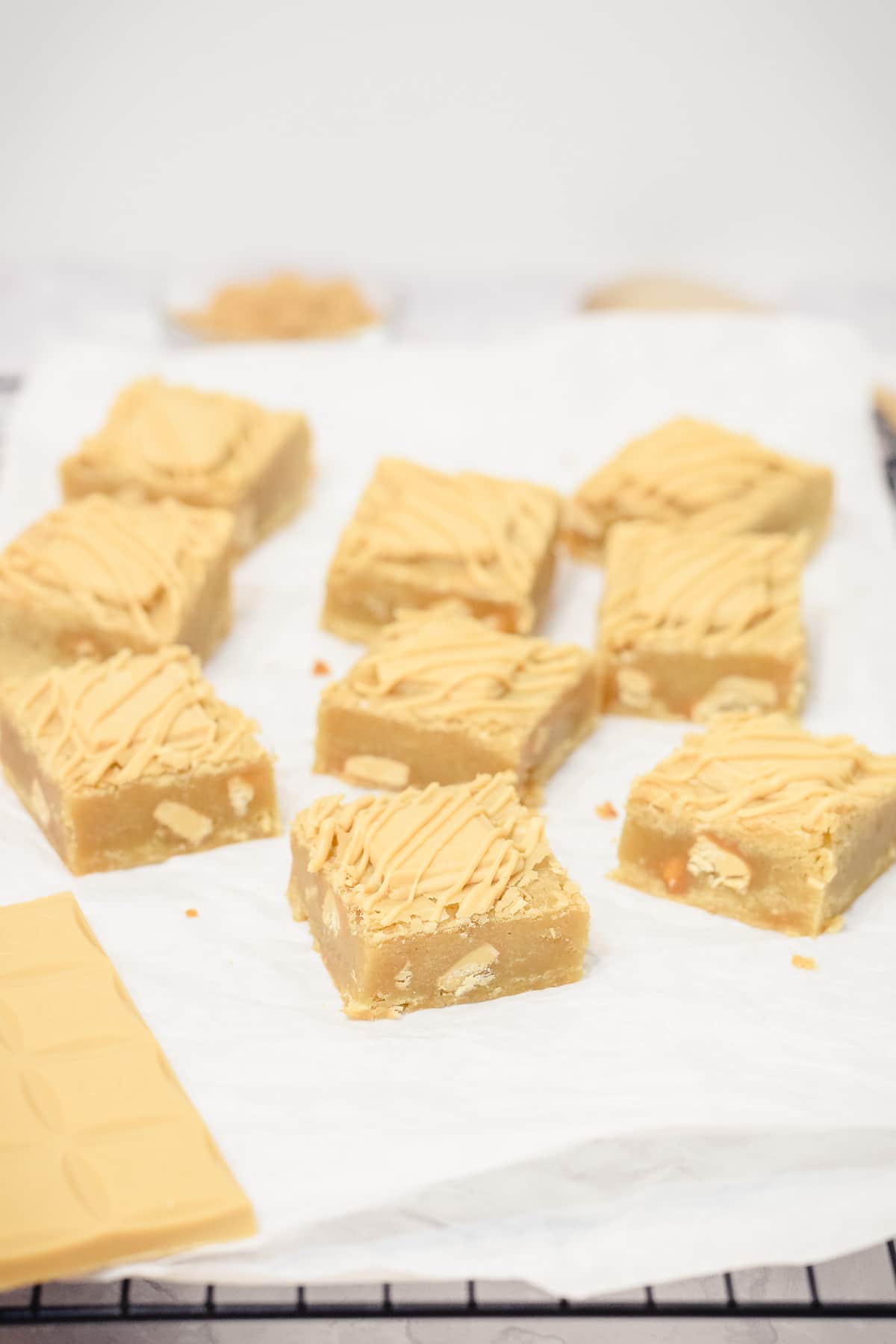 caramilk blondies squares spaced out on paper