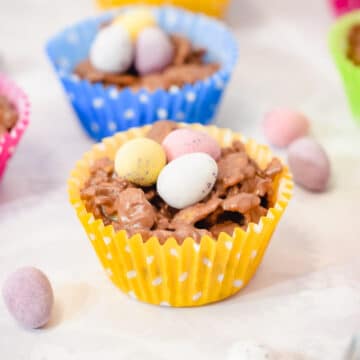 Easter chocolate cornflake nest cakes in cupcake liners topped with mini eggs
