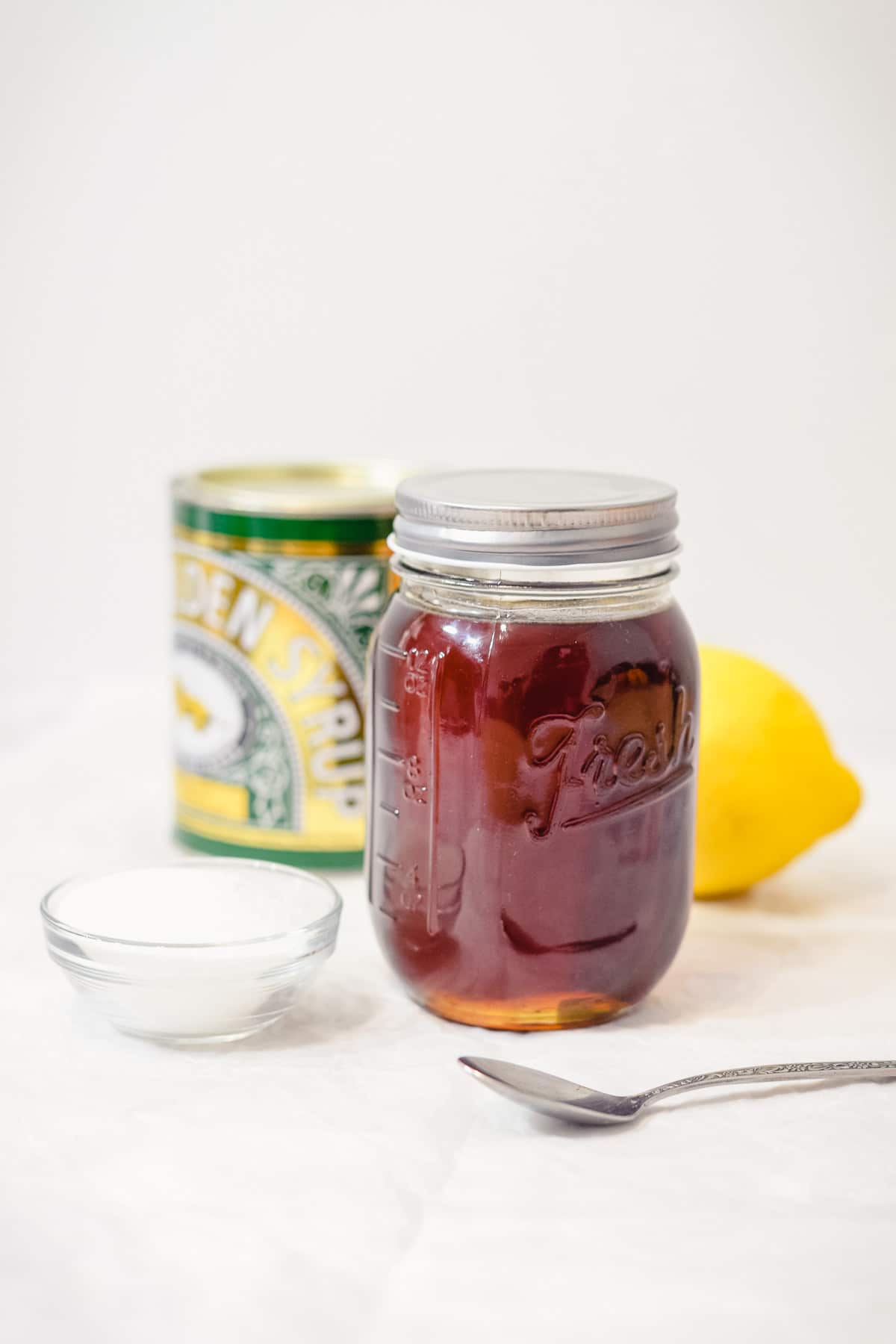 homemade golden syrup in a mason jar with the lid on
