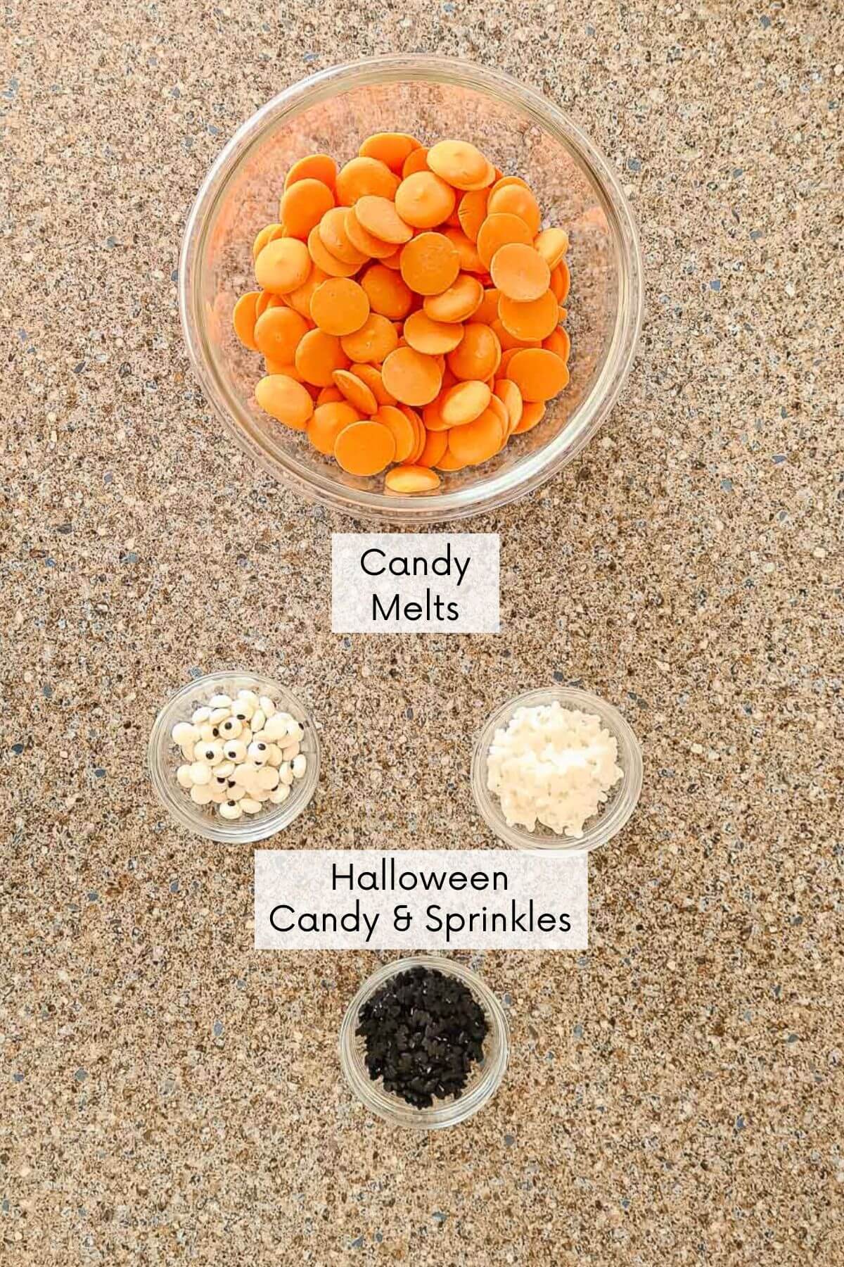 Halloween boo bark recipe ingredients in bowls with labels.