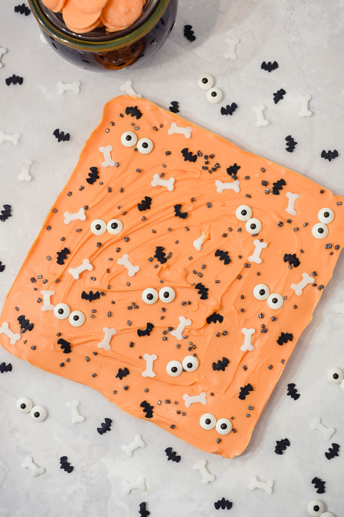 halloween orange coloured bark with candy eyes and Halloween sprinkles as a whole slab.