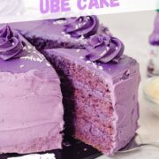 easy purple yam ube layer cake with four layers of ube sponge and ube buttercream frosting topped with coconut.