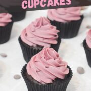 chocolate cupcakes with pink buttercream frosting.