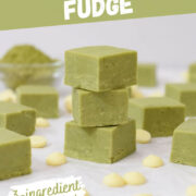 stack of green tea matcha fudge pieces with white chocolate chips and a bowl of matcha powder.