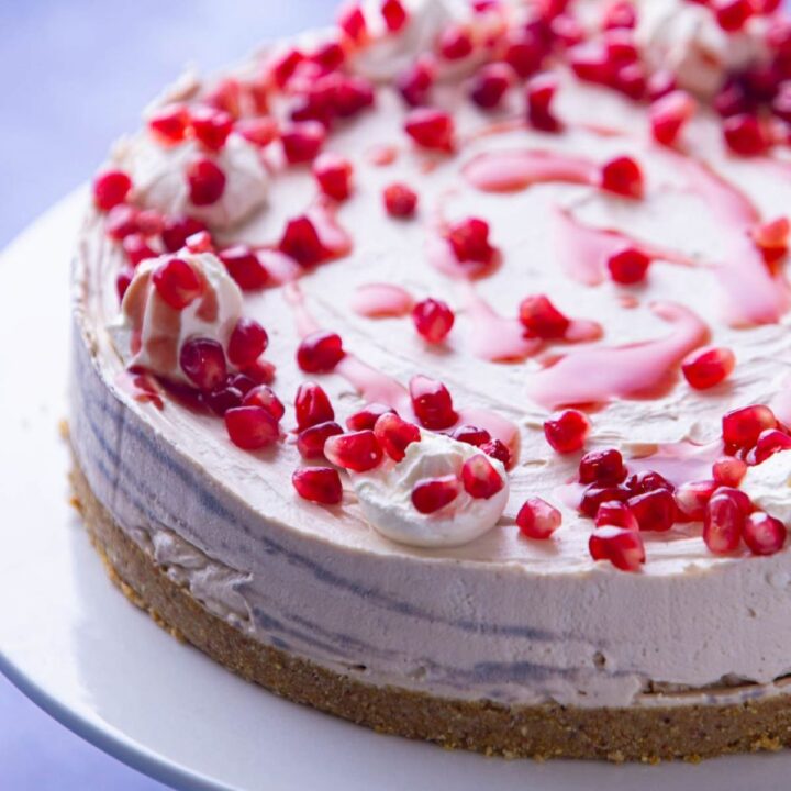 pomegranate cheesecake with pomegranate on top.
