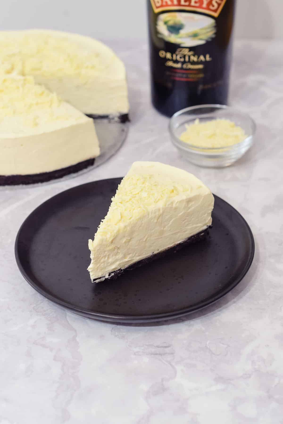 baileys white chocolate cheesecake with an oreo base and white chocolate topping.