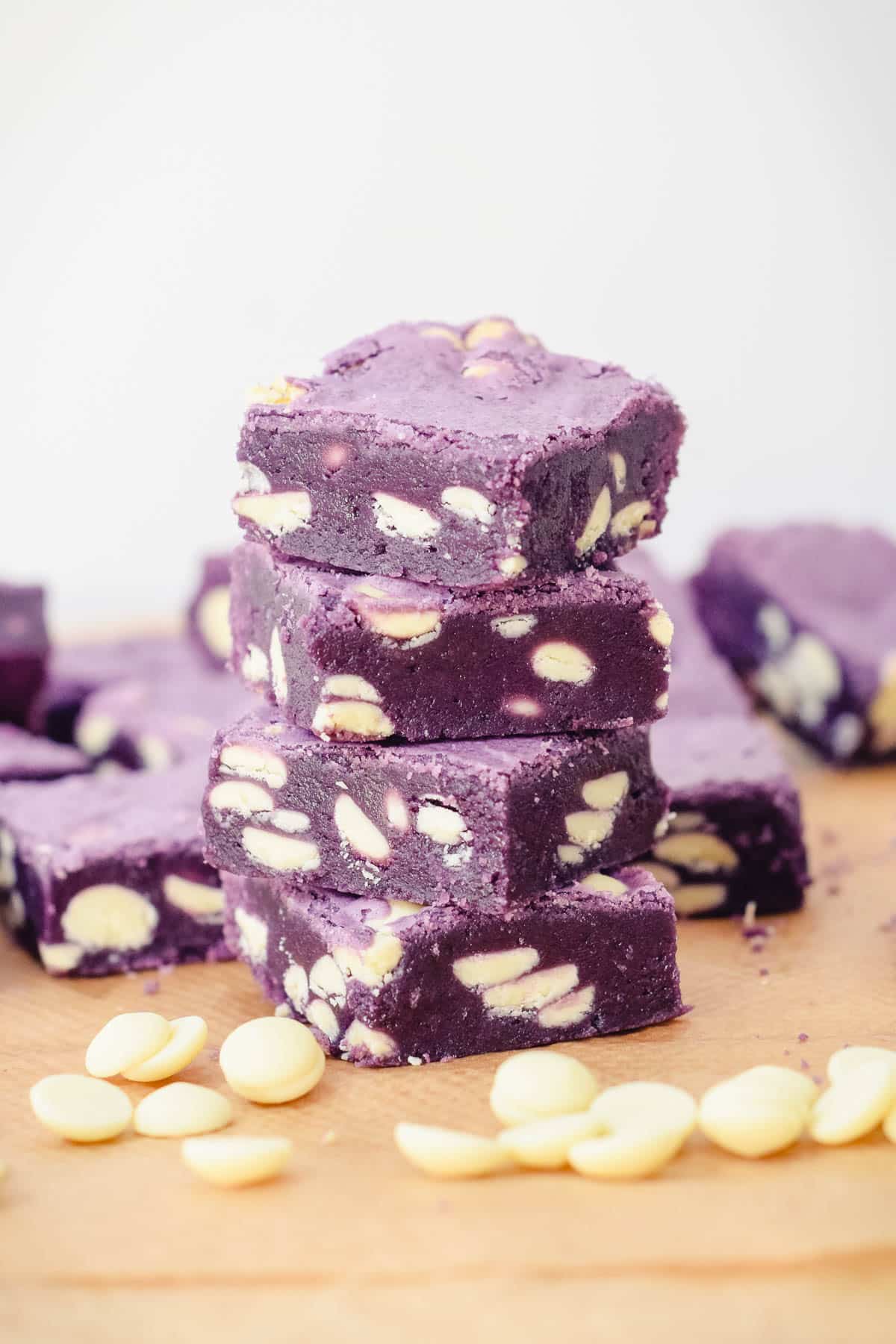 fudgy ube brownies squares with white chocolate chips.