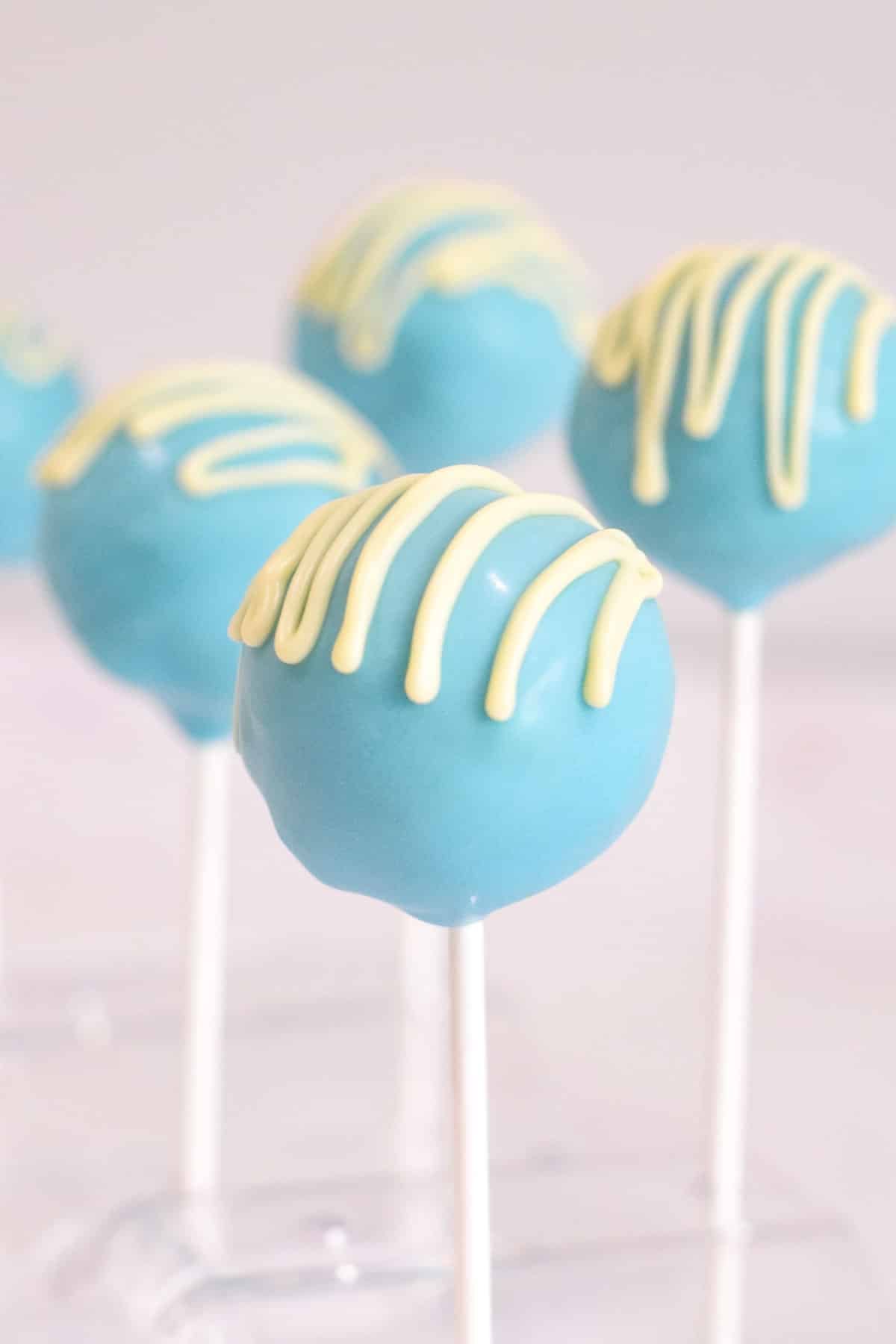 vanilla blue cake pops on sticks.