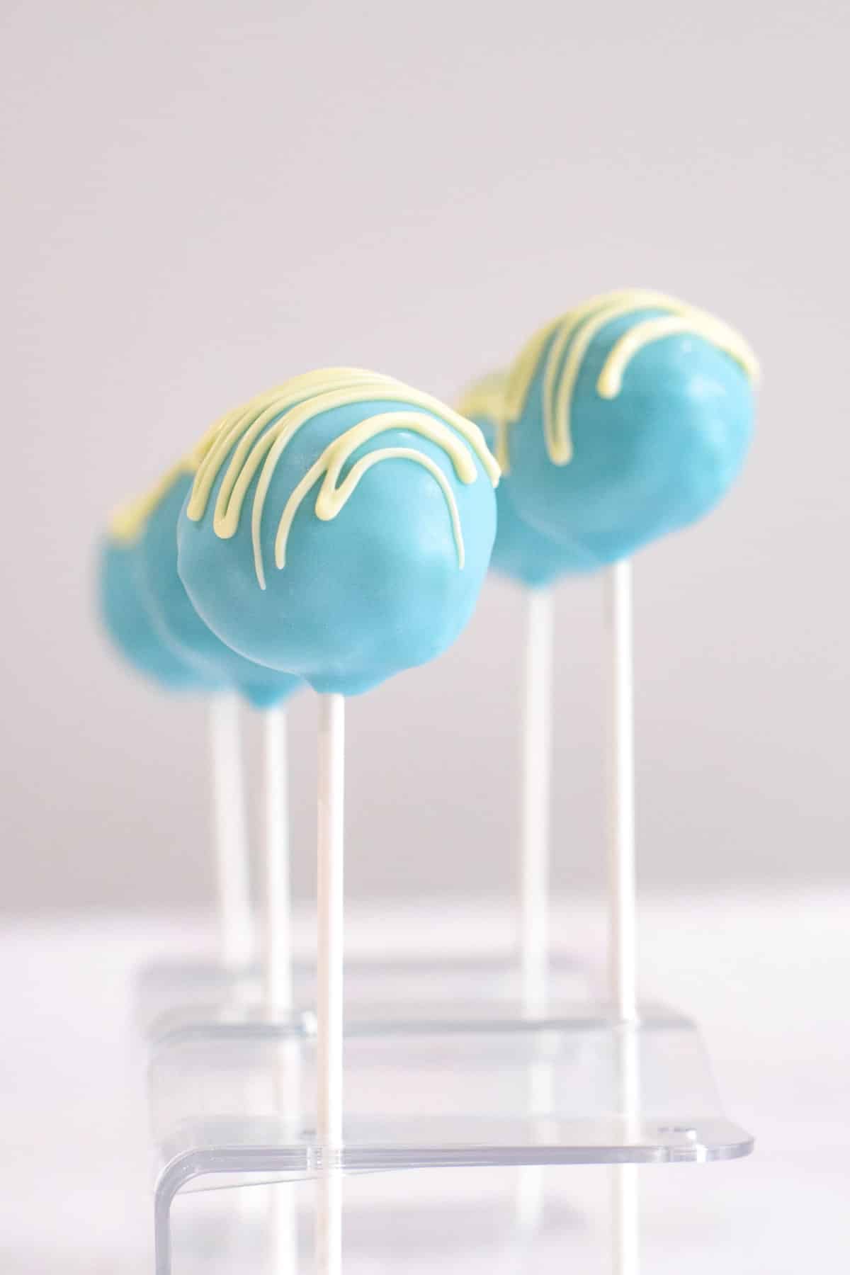vanilla blue cake pops on sticks.