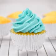vanilla cupcakes with blue buttercream frosting.